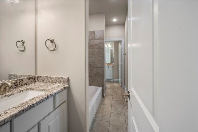 bathroom with tile patterned floors and vanity