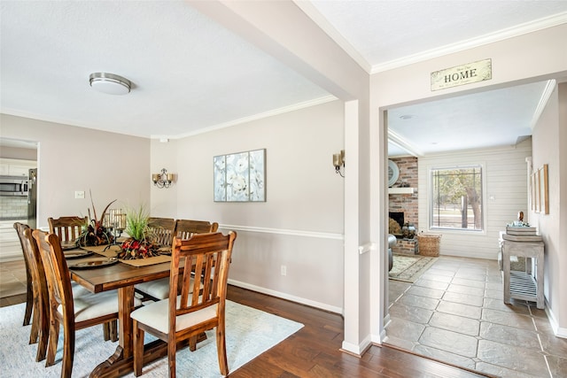 dining area featuring crown molding, dark hardwood / wood-style floors, and a textured ceiling