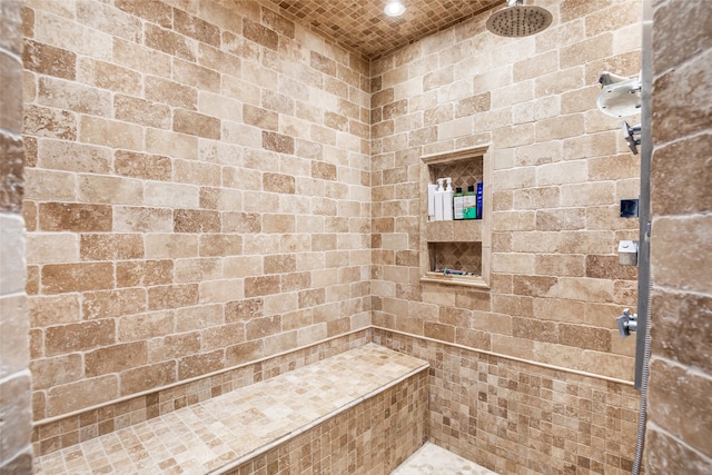 bathroom with a tile shower