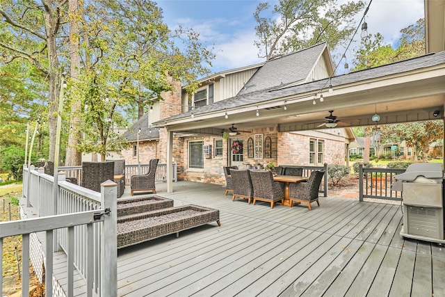 wooden deck with area for grilling and ceiling fan