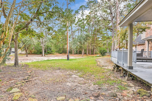 view of yard featuring a wooden deck