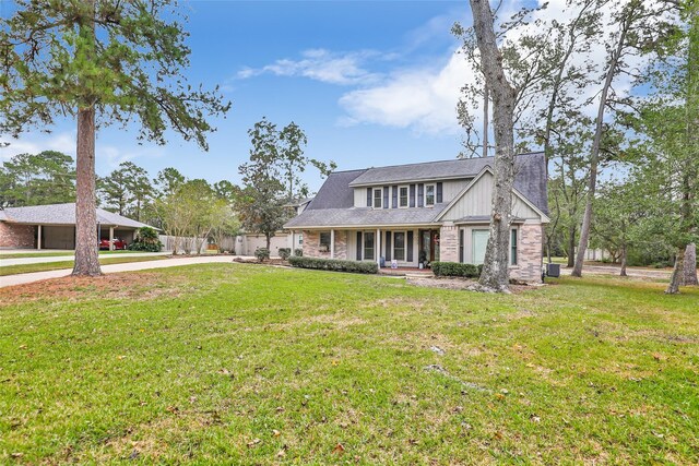 view of front facade with a front lawn and a carport