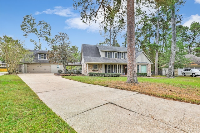 view of front facade with a garage and a front lawn