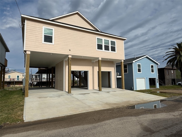 view of front facade with a carport and a garage