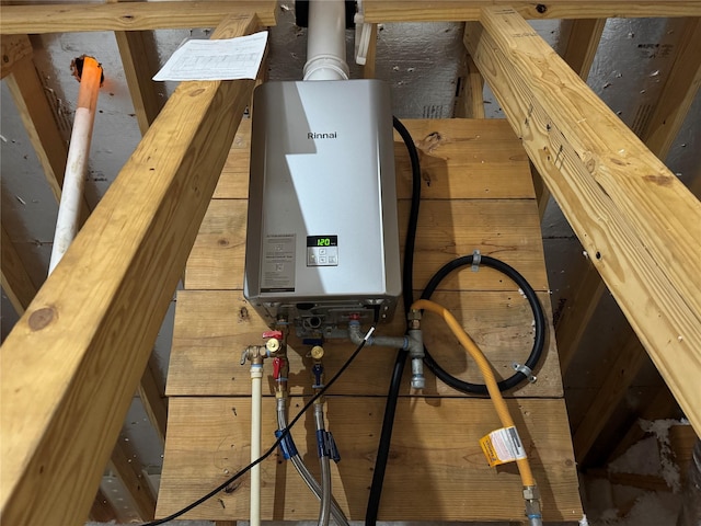 utility room featuring tankless water heater