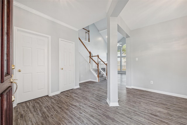 foyer featuring ornamental molding and dark hardwood / wood-style flooring