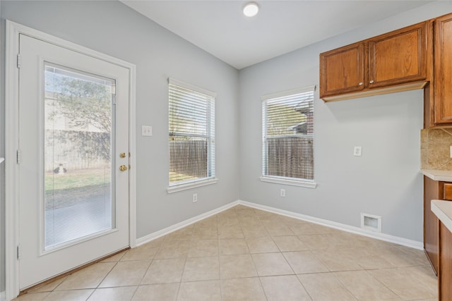 interior space with light tile patterned floors