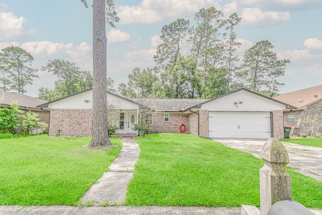 single story home with a garage and a front lawn