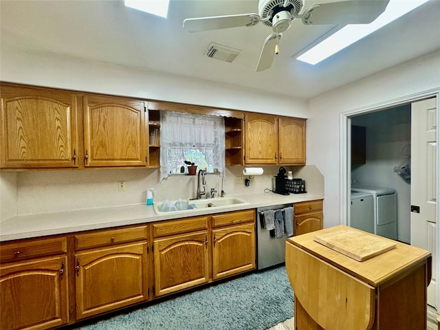 kitchen with dishwasher, ceiling fan, sink, and washer and dryer