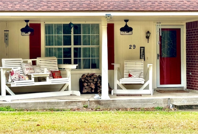 view of exterior entry featuring a porch