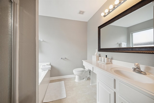 bathroom featuring vanity, toilet, a bathtub, and tile patterned flooring