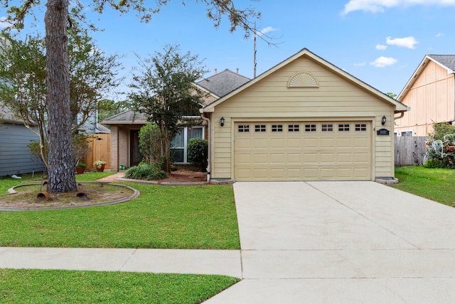 view of front of home with a garage and a front lawn