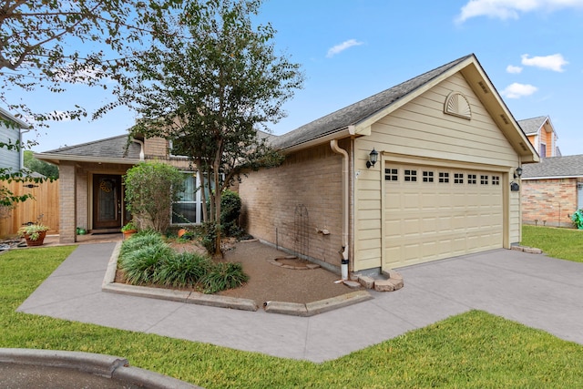 single story home with a garage and a front lawn