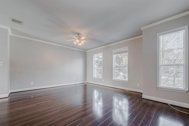 empty room featuring ceiling fan, dark hardwood / wood-style flooring, and ornamental molding