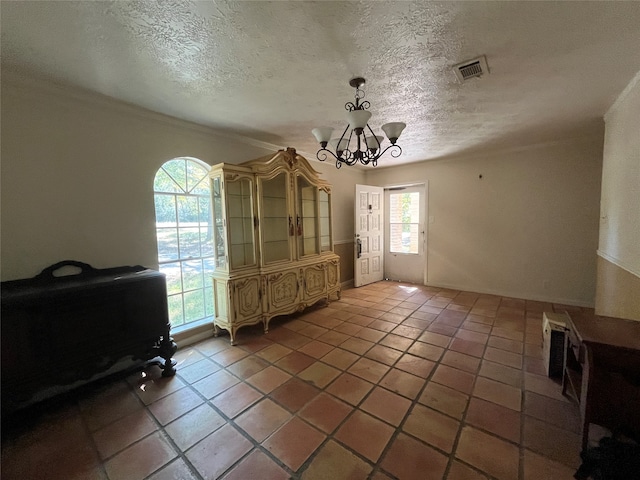 20 Ranchero Rd, College Station, TX 77845 - unfurnished dining area featuring a textured ceiling, plenty of natural light, and tile patterned flooring