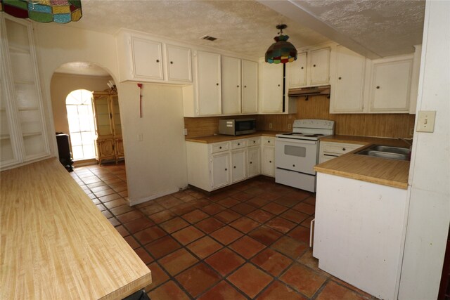 20 Ranchero Rd, College Station, TX 77845 - kitchen with decorative backsplash, white cabinets, sink, and white range with electric cooktop