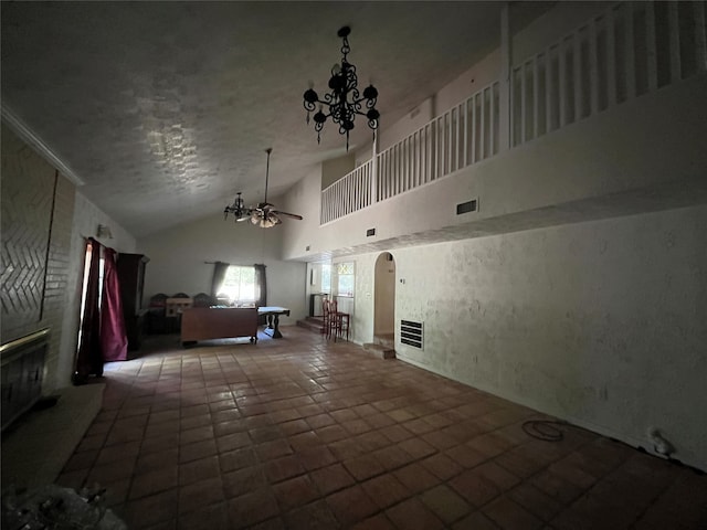 20 Ranchero Rd, College Station, TX 77845 - unfurnished living room featuring high vaulted ceiling, ceiling fan with notable chandelier, and tile patterned flooring