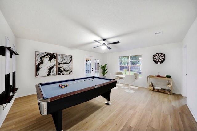 recreation room featuring french doors, light wood-type flooring, ceiling fan, and billiards