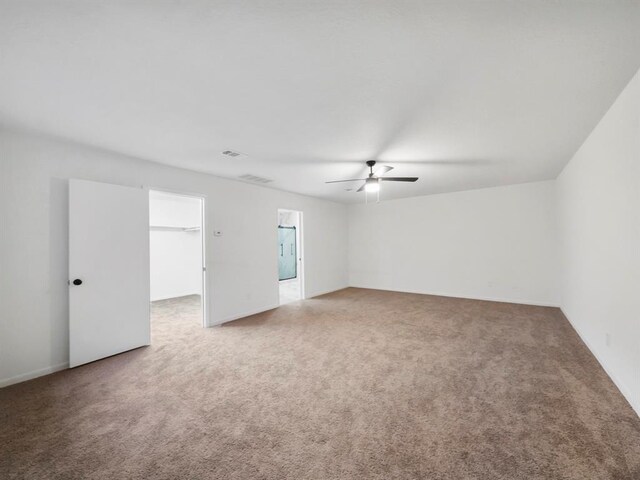 carpeted empty room with ceiling fan