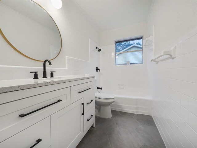 full bathroom featuring bathtub / shower combination, vanity, tile walls, tile patterned flooring, and toilet