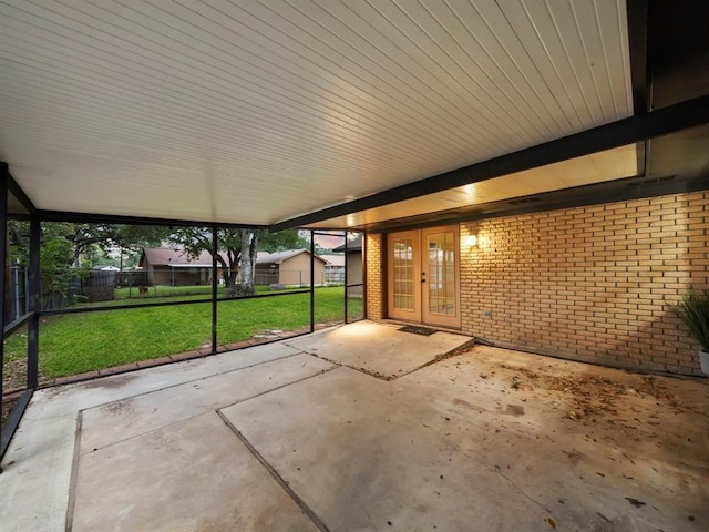 unfurnished sunroom with french doors