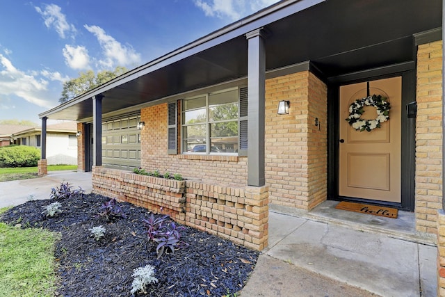 view of exterior entry featuring a garage