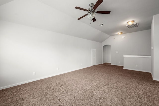 unfurnished living room with vaulted ceiling, carpet flooring, and ceiling fan