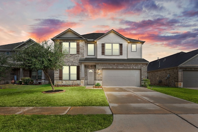 view of front of home featuring a garage and a lawn