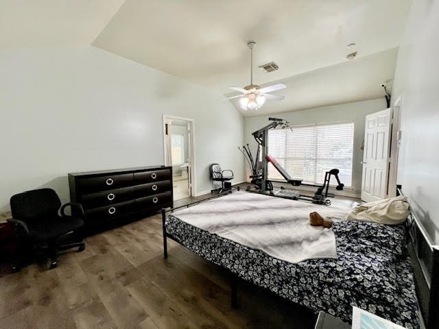 bedroom featuring ensuite bath, wood-type flooring, and ceiling fan