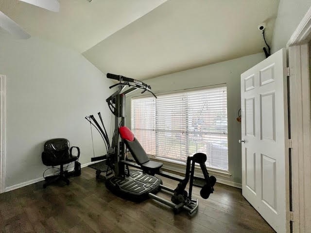 exercise room with dark wood-type flooring