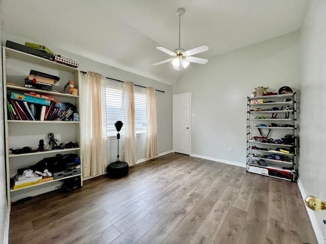 interior space featuring lofted ceiling, hardwood / wood-style floors, and ceiling fan