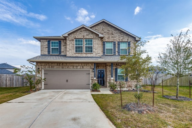 view of front of home with a front lawn and a garage