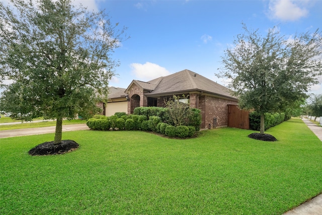 view of front facade with a garage and a front lawn