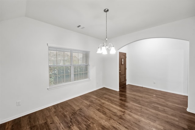 unfurnished room featuring a chandelier, vaulted ceiling, and dark hardwood / wood-style flooring