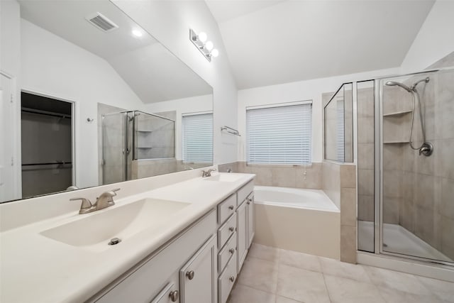 bathroom with vanity, lofted ceiling, plus walk in shower, and tile patterned floors