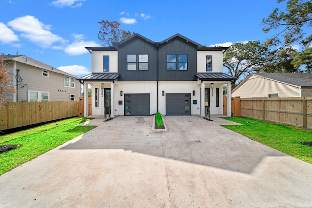 view of front of house with a front lawn and a garage