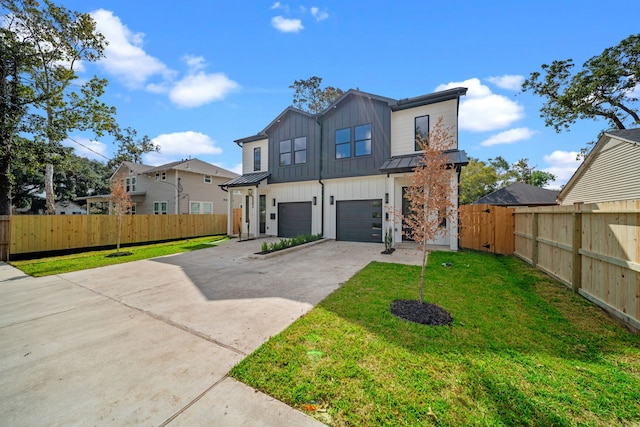 view of front of home featuring a front lawn and a garage