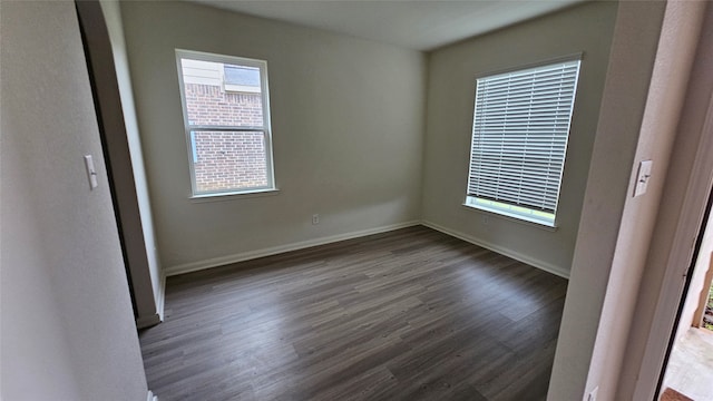 empty room featuring dark hardwood / wood-style floors