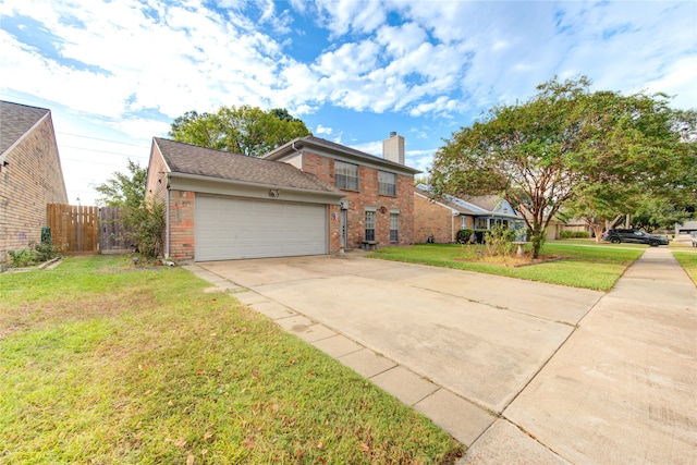 view of front of house featuring a front yard and a garage