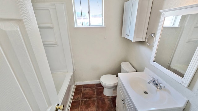 bathroom featuring vanity, toilet, plenty of natural light, and tile patterned flooring