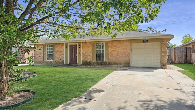 ranch-style home with a front yard and a garage