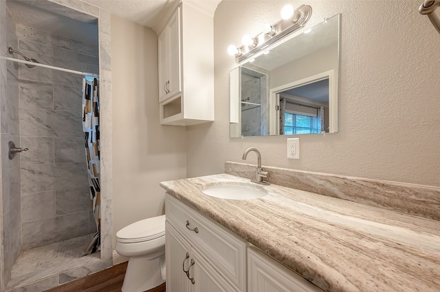 bathroom with vanity, walk in shower, toilet, and wood-type flooring