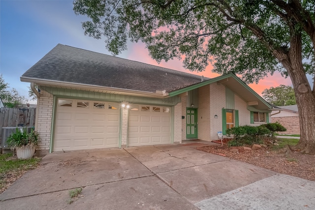 single story home featuring a garage