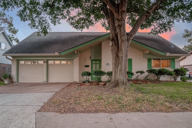 ranch-style home featuring a garage