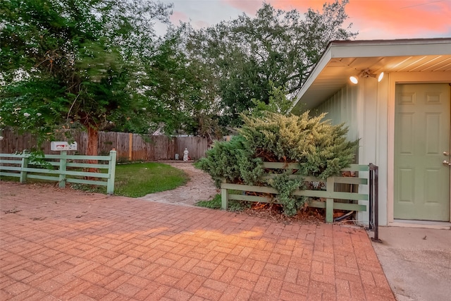 view of patio terrace at dusk