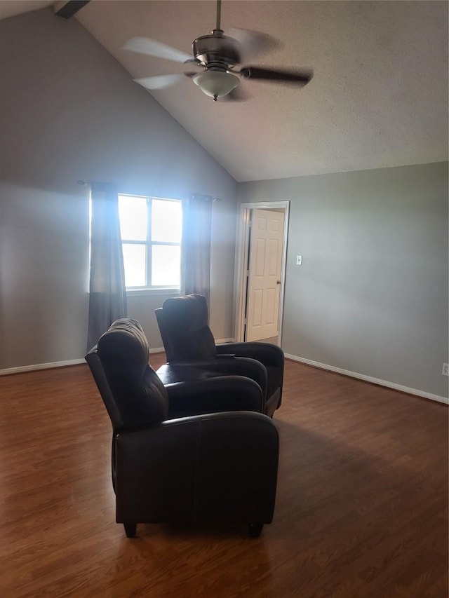 living room featuring vaulted ceiling with beams, dark hardwood / wood-style flooring, and ceiling fan