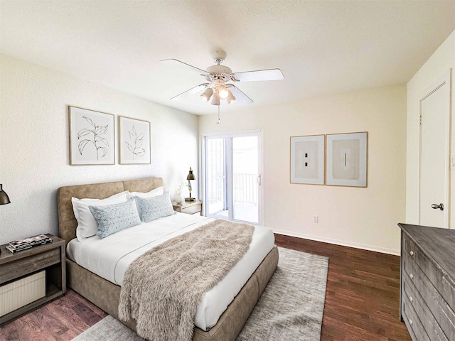 bedroom with a ceiling fan, baseboards, access to outside, and dark wood finished floors