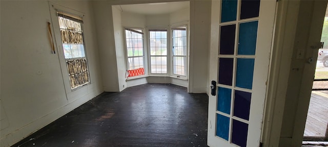 spare room with dark hardwood / wood-style flooring