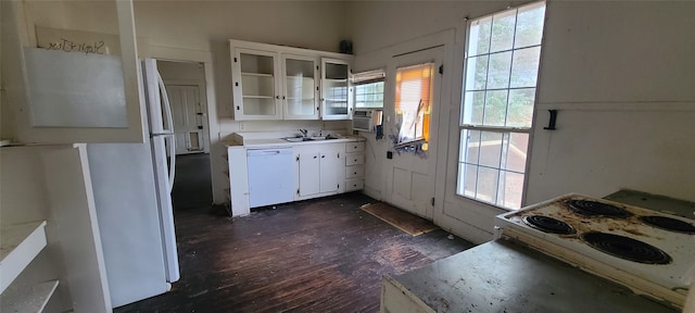 kitchen with sink, dark wood-type flooring, white cabinetry, and white appliances