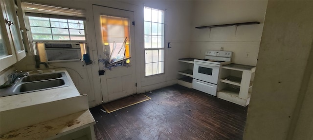 kitchen with dark hardwood / wood-style floors, cooling unit, sink, and white range with electric stovetop